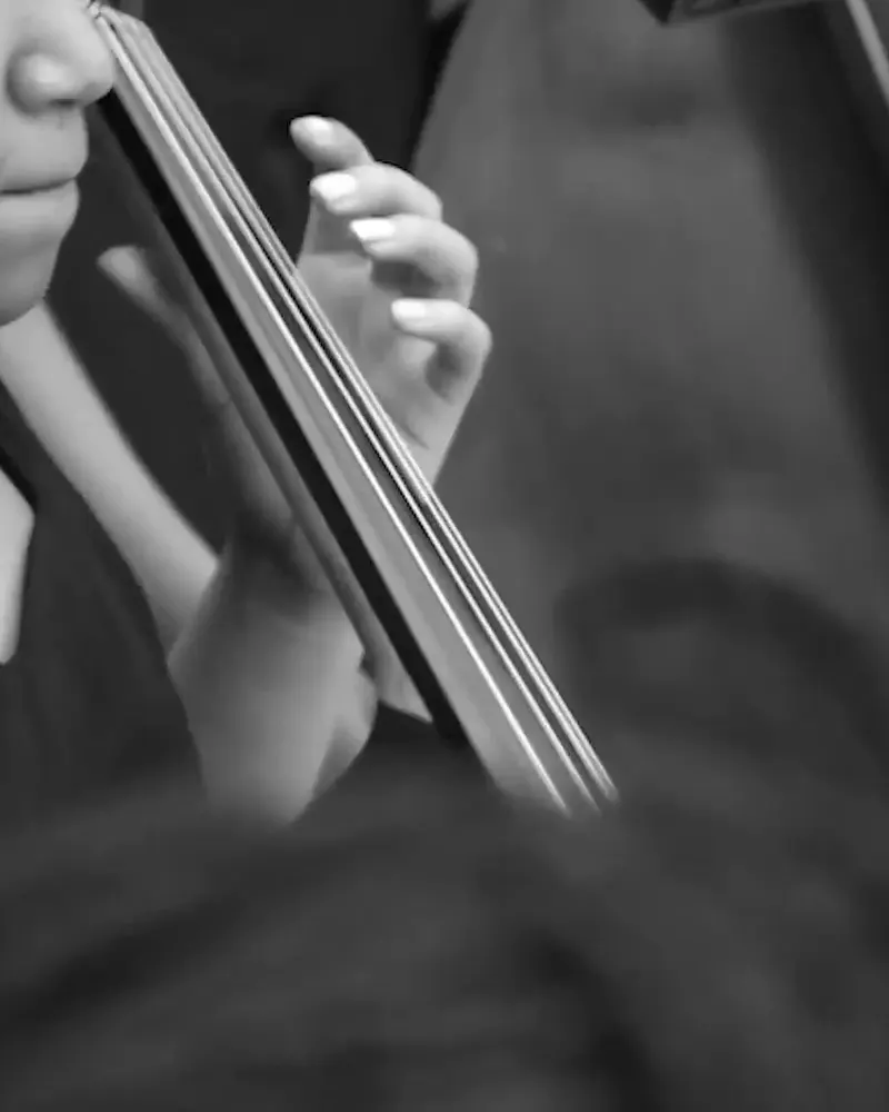 An authentic monochrome close-up of a cello student from the Noel Pointer Foundation anniversary film.
