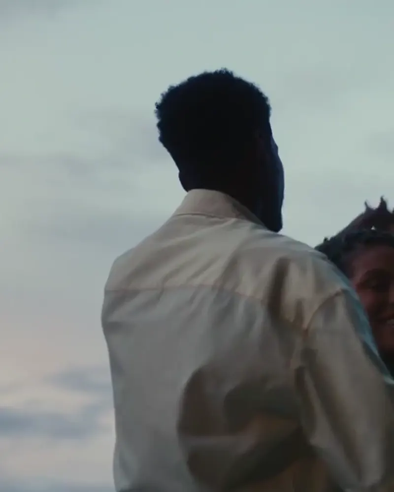 A couple sharing a quiet moment in the Black Men Love campaign.