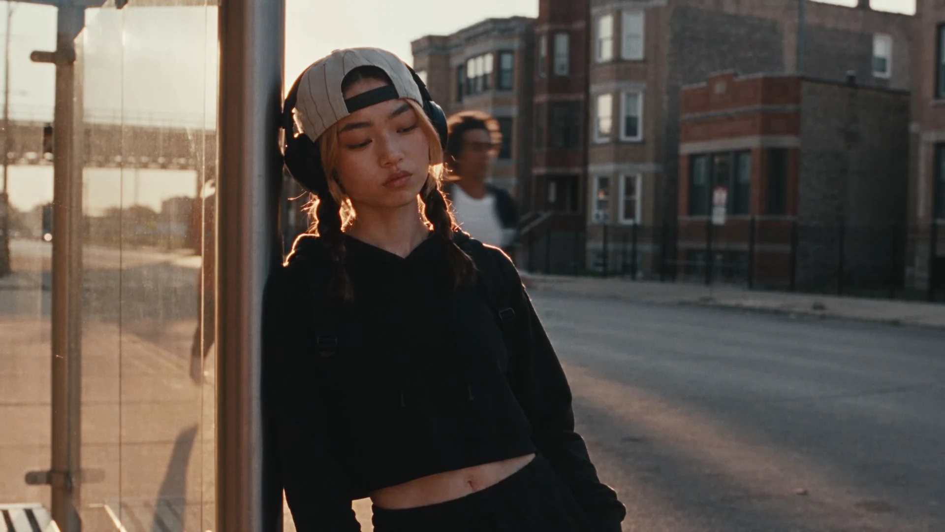 A headphone-wearing fan in a close-up from the Rate x White Sox campaign.