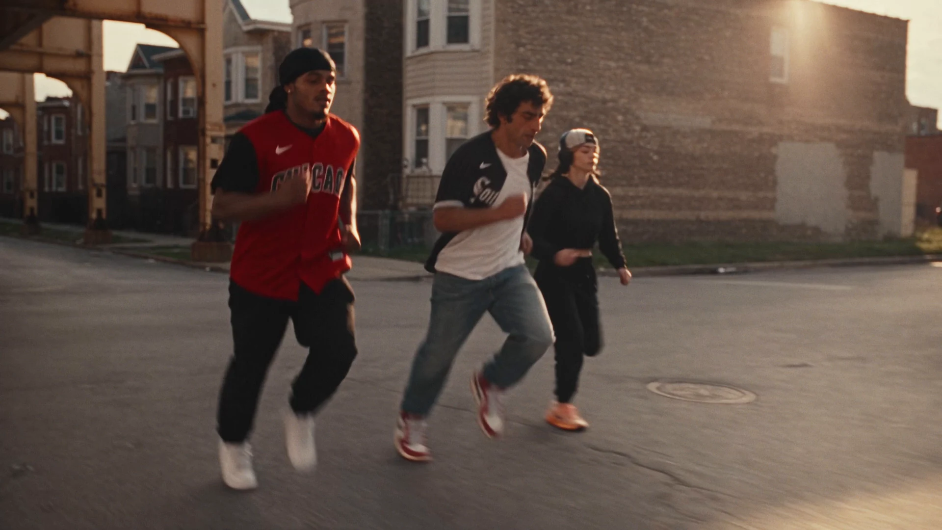 Three fans running through Chicago at golden hour in the Rate x White Sox Pull Up campaign.