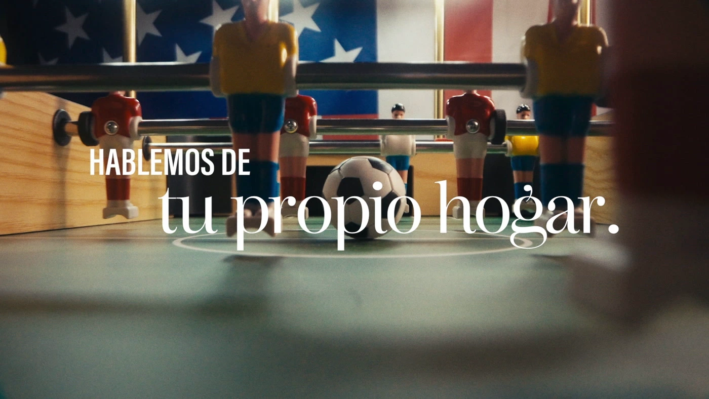 A foosball table, United States flag and Spanish homeownership headline in the completed Rate.com World Cup spot.