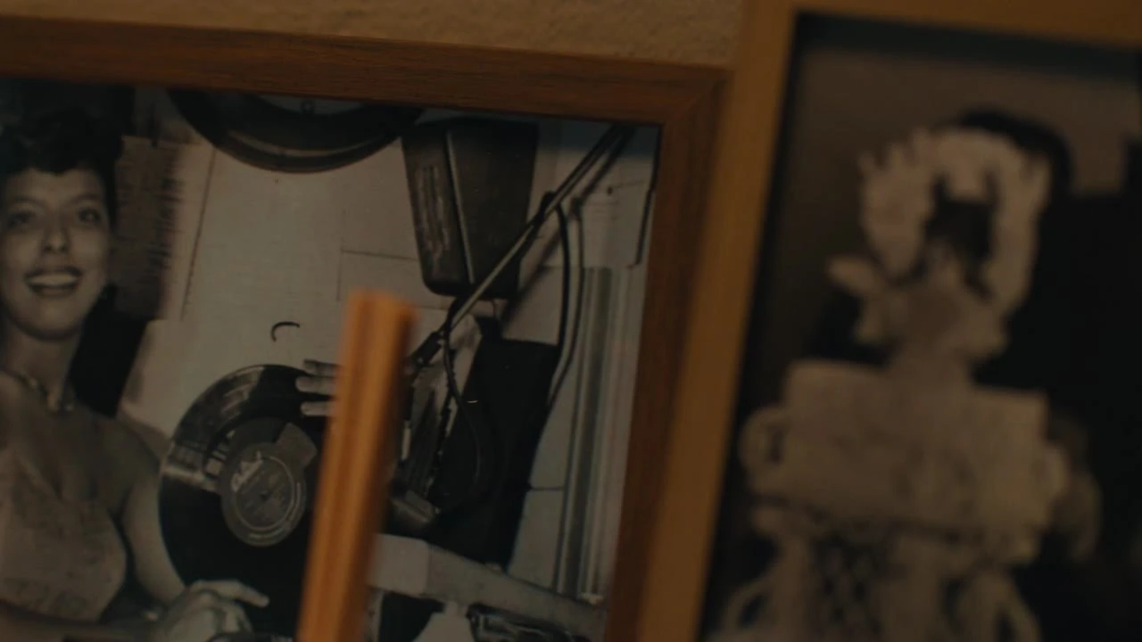 Framed family photographs shown in the Black Men Love film.